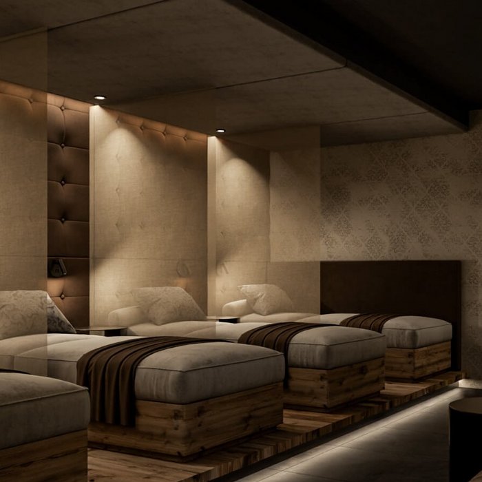 Ligne Mille de luxe facial Cozy spa waiting area with lounge chairs and soft lighting
